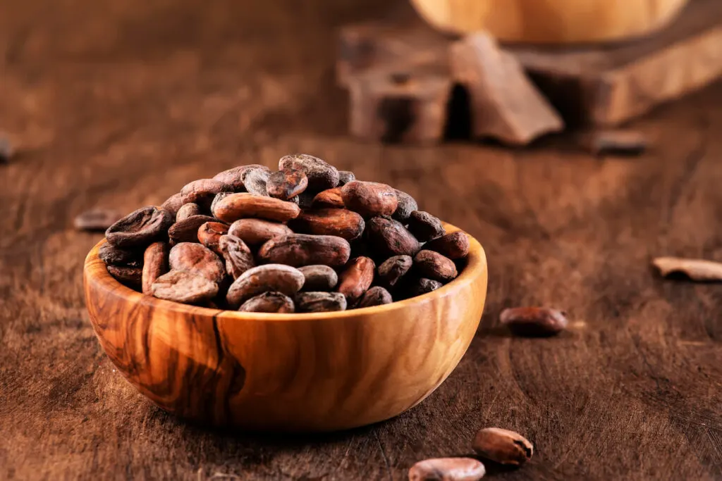 cocoa beans in a wooden bowl