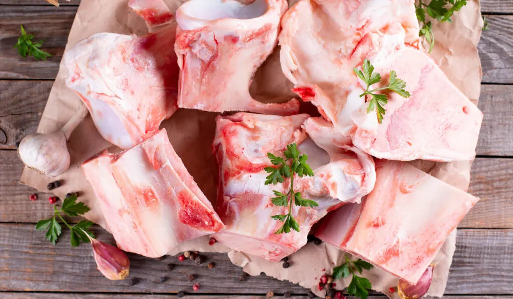 Beef bone on wooden background